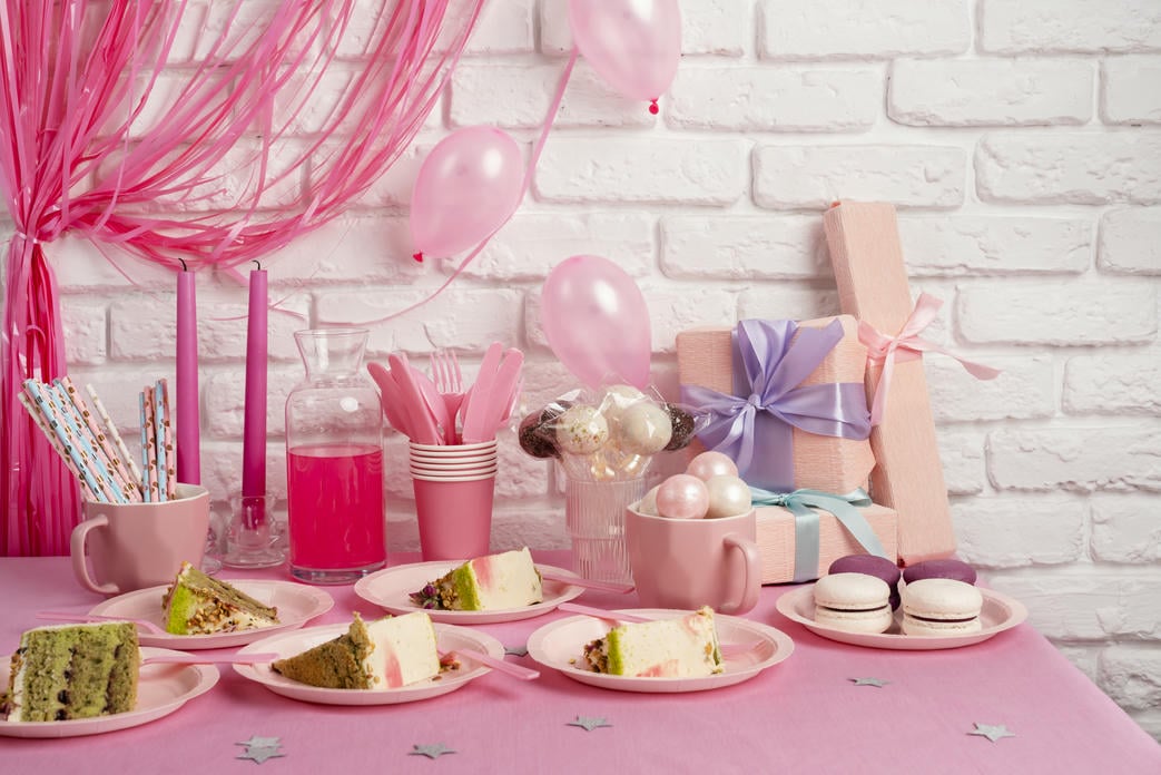 table-arrangement-birthday-event-with-slices-cake-macaroons